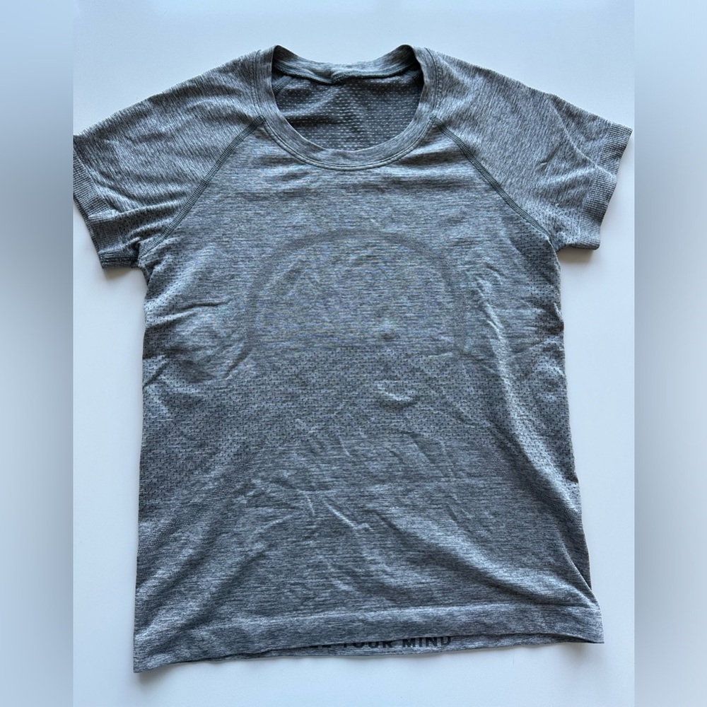 Gray Lululemon swiftly tee; tech race length, size four